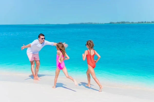 Happy family enjoying beach time and have a lot of fun — Stock Photo, Image