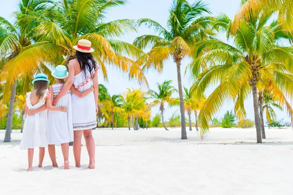 Adorable little girls and young mother on white beach — Stock Photo, Image