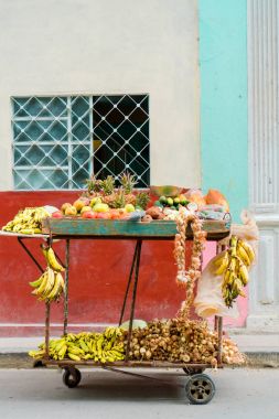 A small cart of fruits and vegetables on the street of Old Havana area for sale. clipart