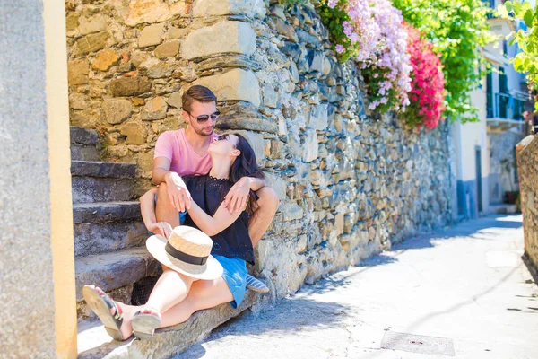 Happy couple traveling at italian old village on european holidays outdoors in Cinque Terre