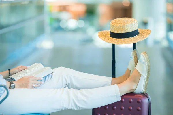 Young woman in an airport lounge waiting for landing — Stock Photo, Image