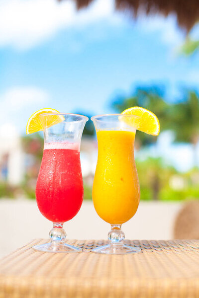 Close up fresh watermelon and mango cocktails on tropical resort