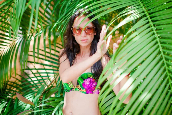 Young sexy woman in swimsuit on the beach in exotic island — Stock Photo, Image