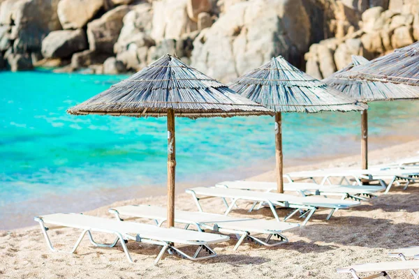 Tropical beach with umbrellas — Stock Photo, Image