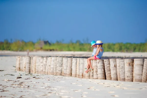 Adorable little girls during summer vacation on the white beach — Stock Photo, Image