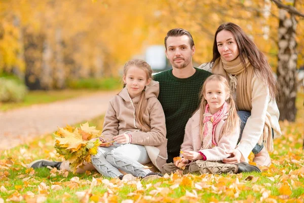 Beautiful happy family of four in autumn day outdoors — Stock Photo, Image