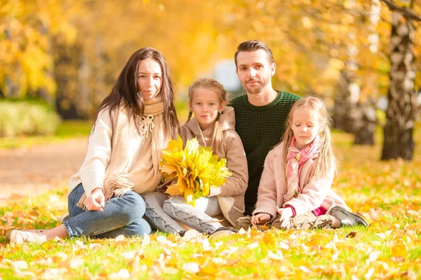 Beautiful happy family of four in autumn day outdoors — Stock Photo, Image