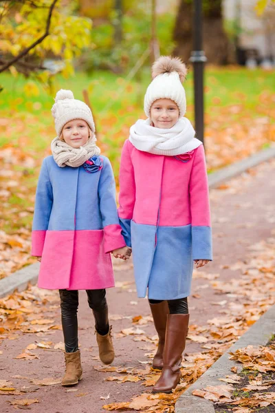 Little adorable girls outdoors at warm sunny autumn day — Stock Photo, Image