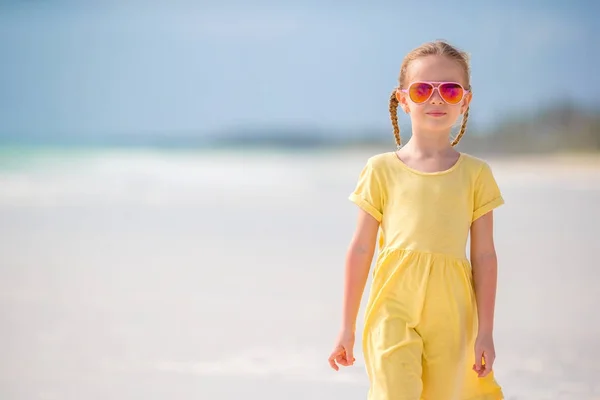 Active little girl on white beach. Closeup kid background the sea — Stock Photo, Image