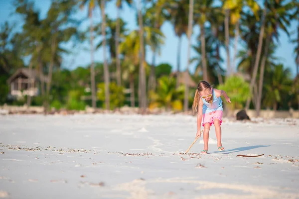 Active little girl on white beach having fun. Closeup kid background the sea — Stock Photo, Image