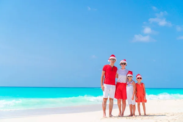 Happy family on beach Christmas vacation — Stock Photo, Image