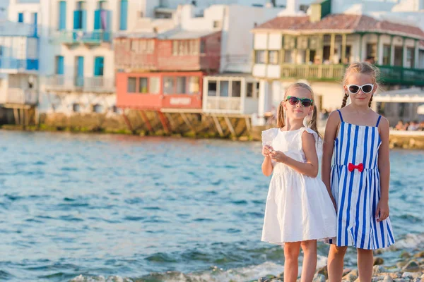 Adorable little girls on vacation on Mykonos island, Greece. — Stock Photo, Image