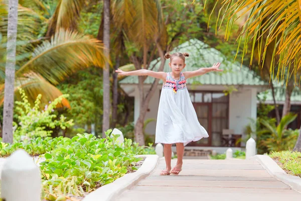 Active little girl at beach having a lot of fun. — Stock Photo, Image