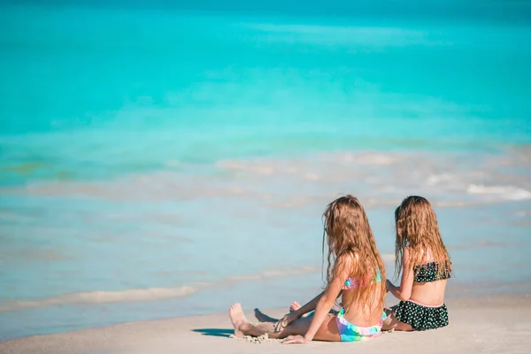 Adorable little girls relaxing on the beach — Stock Photo, Image