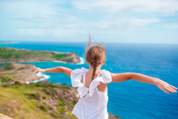 Adorable little girl with a beautiful views from Shirley Heights on Antigua island in Caribbean — Stock Photo, Image