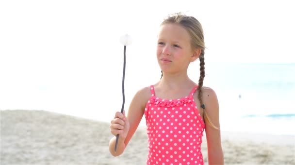 Adorable little girl have fun at tropical beach during vacation. SLOW MOTION — Stock Video