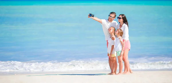 Panorama of happy beautiful family on the beach — Stock Photo, Image