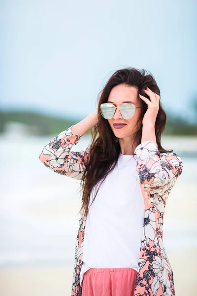 Young beautiful woman on white sand tropical beach. Caucasian girl in sunset — Stock Photo, Image