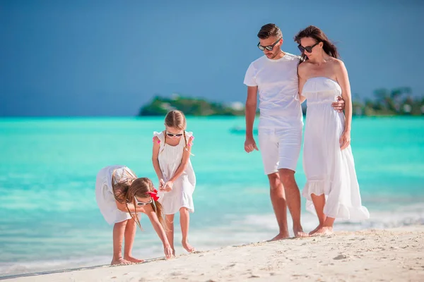 Happy beautiful family on white beach — Stock Photo, Image
