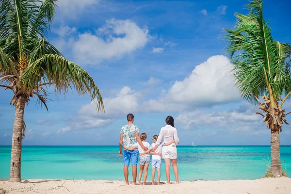 Happy beautiful family with kids on the beach — Stock Photo, Image