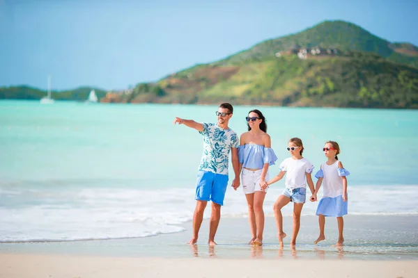 Happy beautiful family with kids on the beach — Stock Photo, Image