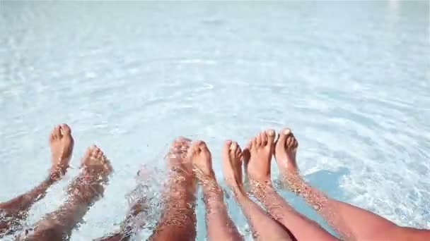 Close up of four peoples legs by pool side — Stock Footage Close up of four peoples legs by pool side Royalty Free Stock Footage