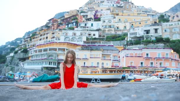 Adorable little girl on warm and sunny summer day in Positano town in Italy — Stock Video