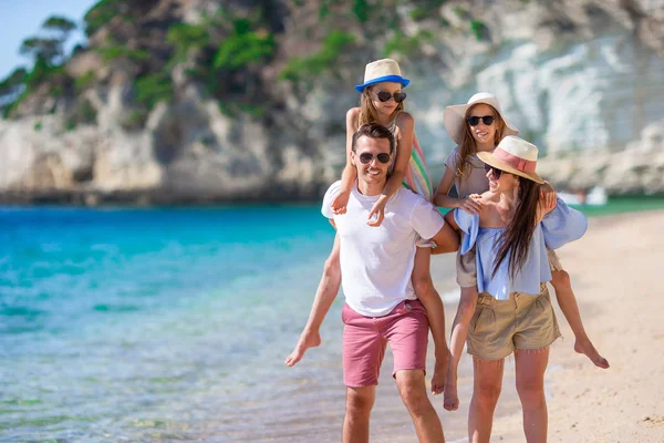 Happy beautiful family with kids on the beach — Stock Photo, Image