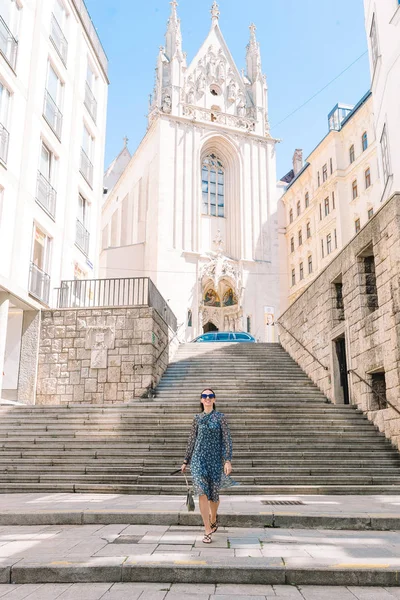 Young woman in Vienna outdoors during holidays in Europe.