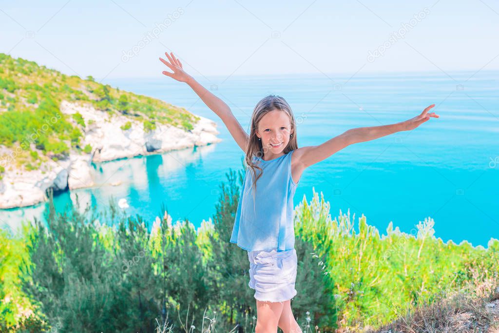 Little girl on vacation travel background beautiful landscape