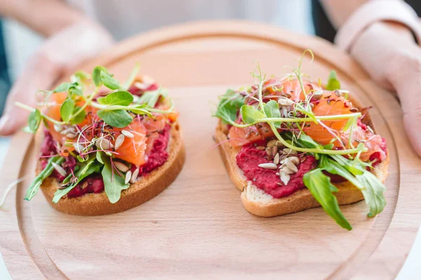 Tasty italian bruschetta on the wooden plate — Stock Photo, Image