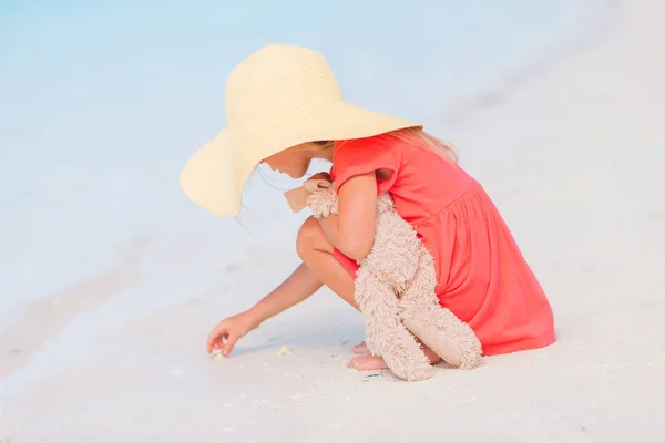 Little adorable girl playing on beach with ball — Stock Photo, Image