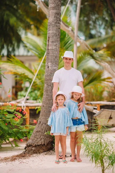 Happy beautiful family of dad and kids on white beach — Stock Photo, Image