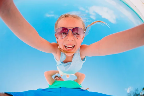 Active little girl on white beach having fun. Closeup kid background the sea — Stock Photo, Image