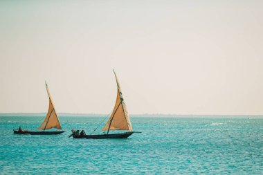 Beautiful cozy bay with boats and clear turquoise water