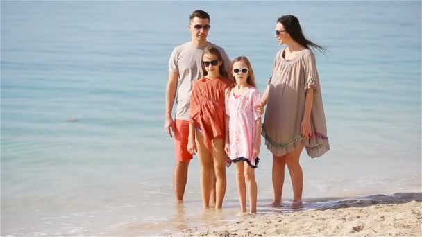 Young family of four on beach vacation — Stock Video