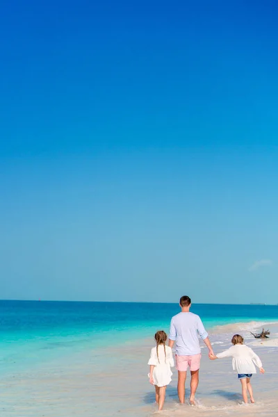 Happy beautiful family on a tropical beach vacation — Stock Photo, Image