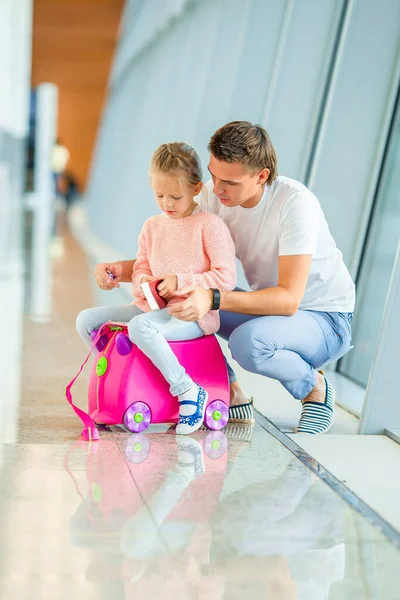 Happy family with two kids in airport have fun waiting for boarding — Stock Photo, Image