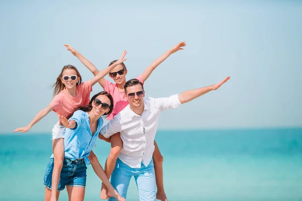 Photo of happy family having fun on the beach. Summer Lifestyle — Stock Photo, Image