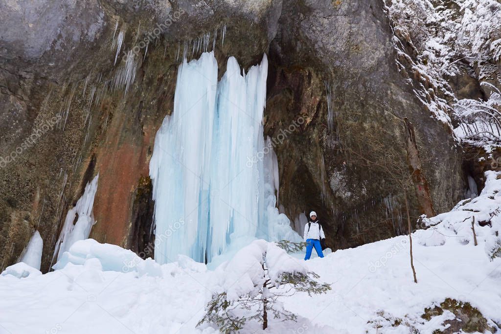 Big frozen waterfall in Seven Ladders Canyon (Canionul Sapte Scari), a popular hiking destination in Winter in Brasov county, Romania.