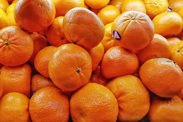 orange and fresh orange with supermarket label