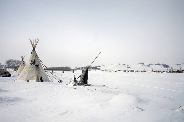 Tipi at the edge of the frozen Cannon Ball River, Cannon Ball, North Dakota, USA, January 2017