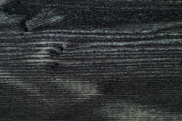Primer plano de una textura de tablero oscuro. Madera cepillada macro . — Foto de Stock