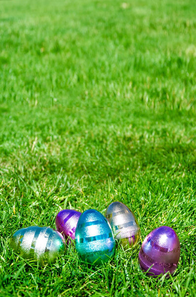 Easter eggs on the grass background