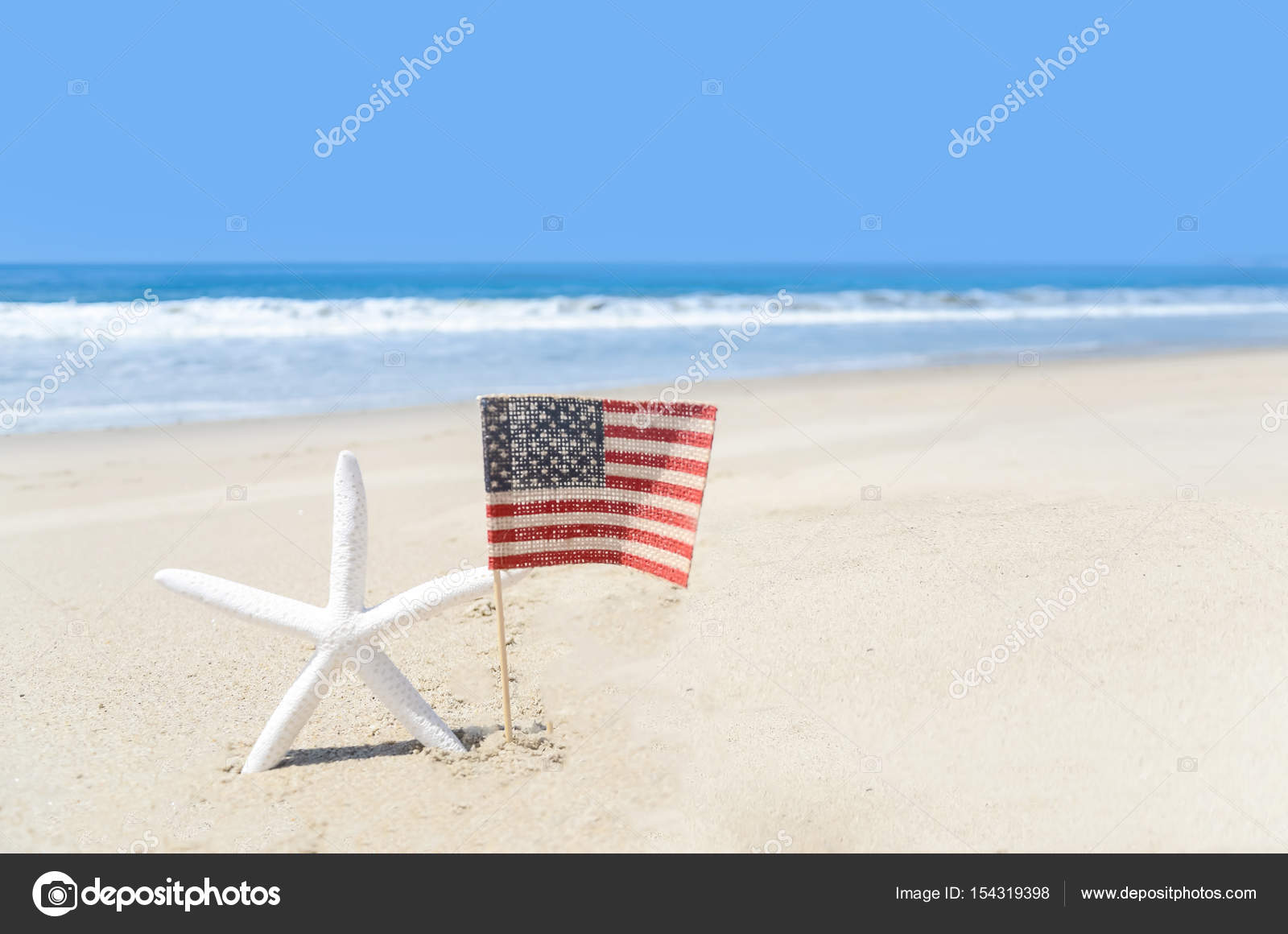 Patriotic Usa Background With Starfish On The Sandy Beach Stock Patriotic Usa Background With Starfish And American Flag On The Sandy Beach Photo By Ellensmile