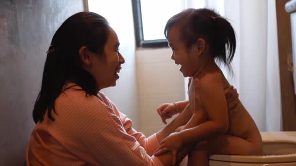 Adorable Asian Child Girl Sitting Toilet Bowl Her Mother Home — Stock Video