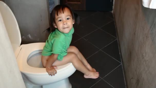 Adorable Asian Child Girl Sitting Toilet Bowl Home Morning Health — Stock Video