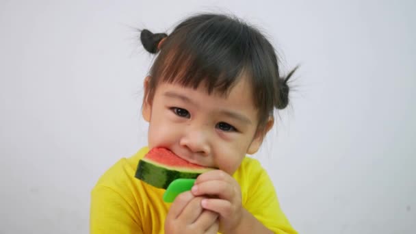 Portrait Happy Smiling Asian Child Girl Enjoy Eating Watermelon Isolated — ストック動画