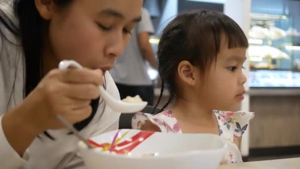 Asian Mother Feeding Noodle Her Daughter Restaurant Feed Caution Due — Stock Video