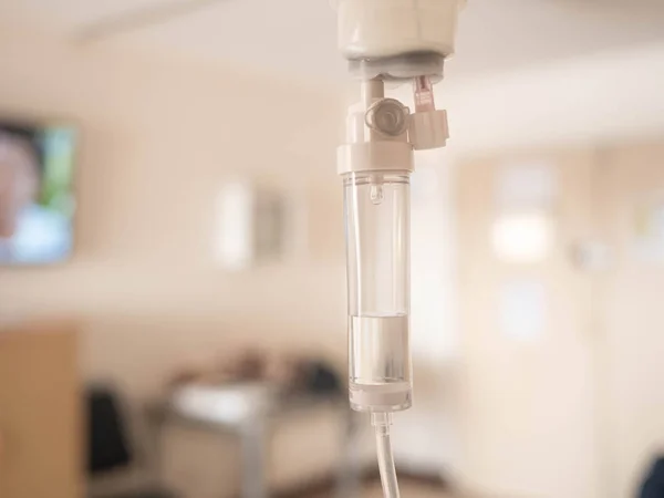 Close-up of Saline solution drip for patient and infusion pump o — Stock Photo, Image